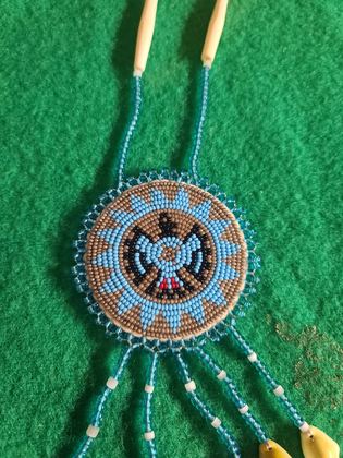 Beaded thunderbird rosette medallion necklace with bone hairpipe and cowrie shell drops, plate 109