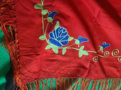 Red wool dance shawl with embroidered blue roses, "Indian Shawl — Ashland, Montana" label, plate 12