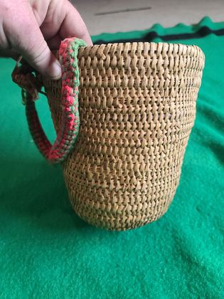 Coiled cedar-root gathering basket with crocheted yarn rim and handle, plate 195