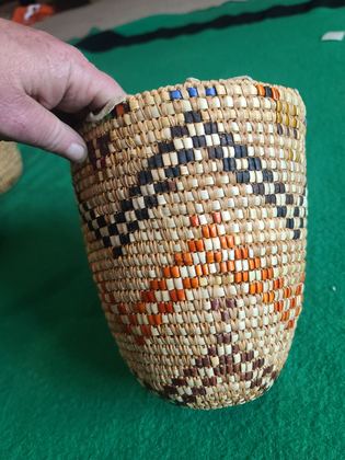 Fully imbricated coiled cedar-root berry basket with hide rim loops, plate 202